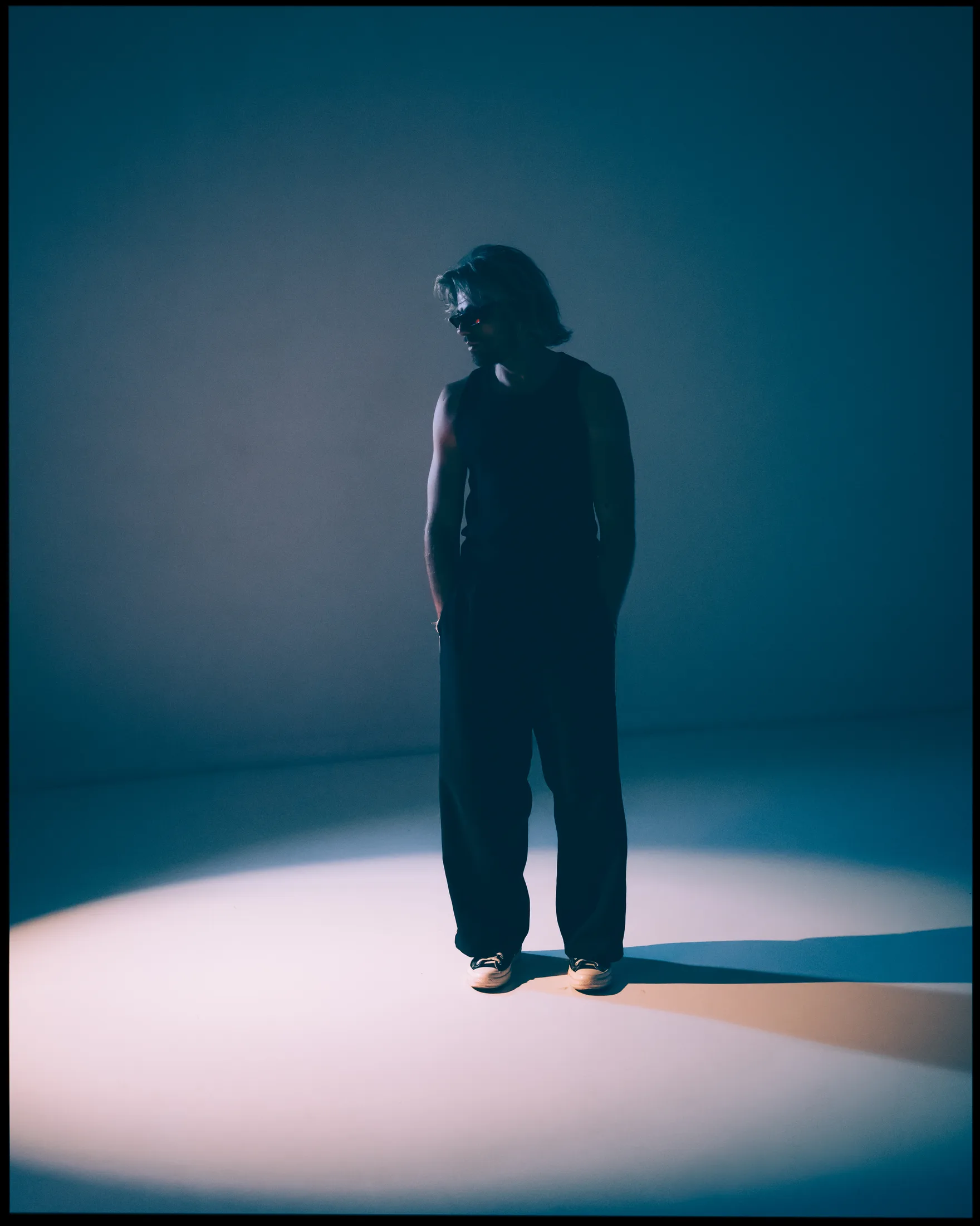 Goldcher in a white spotlight