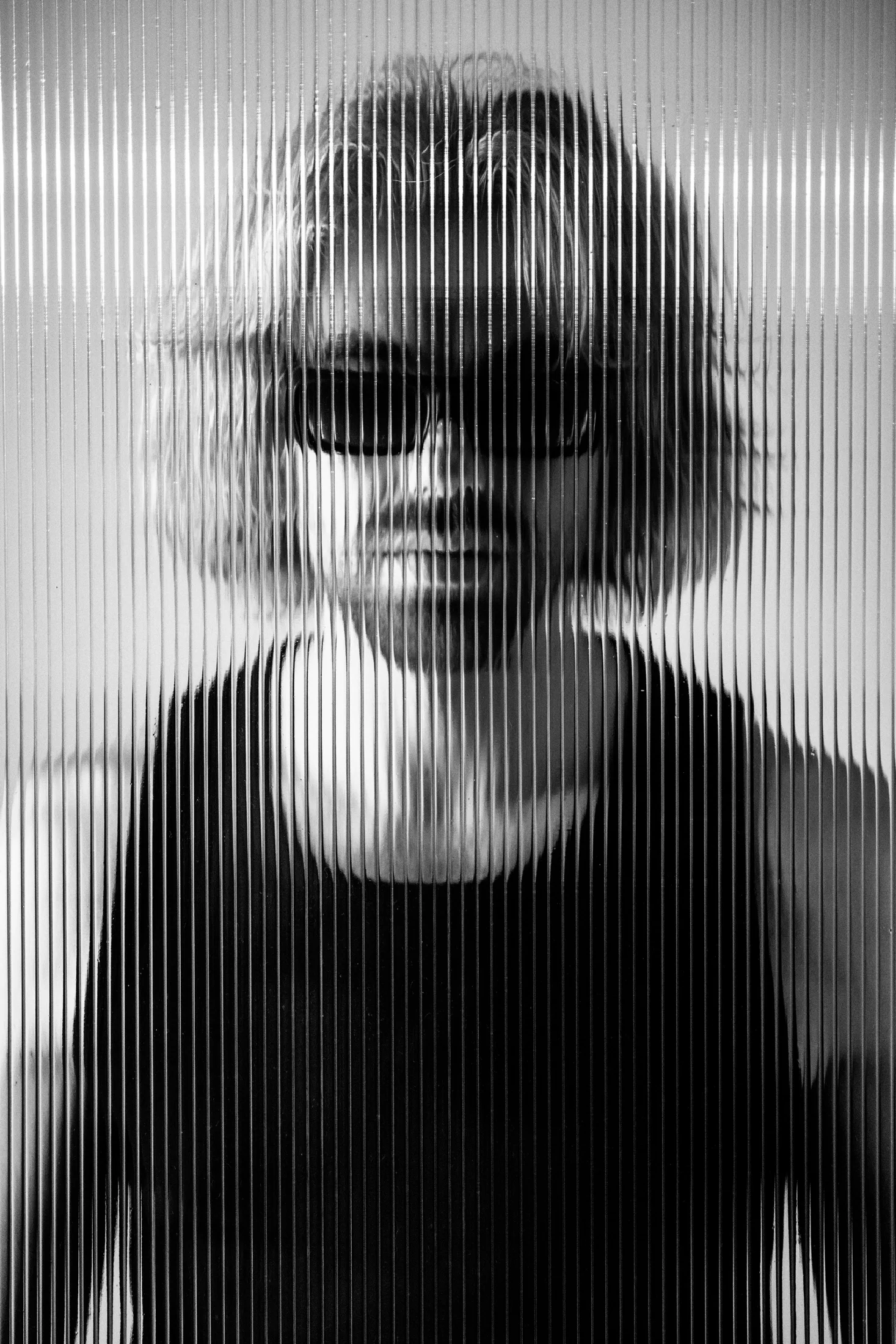 Black and white distorted portrait of Goldcher